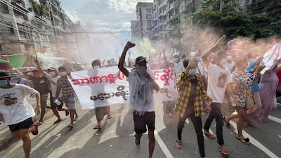 Demonstrators march during an anti-coup protest in downtown Yangon, Myanmar, on July 3. EPA