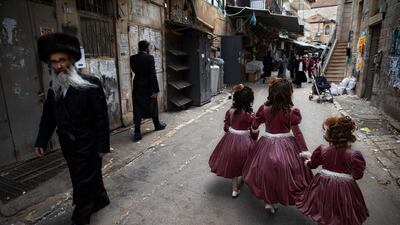 Ultra-Orthodox Jewish girls in Jerusalem are dressed to celebrate the holiday of Purim, which commemorates the Jews' salvation from genocide in ancient Persia. AP