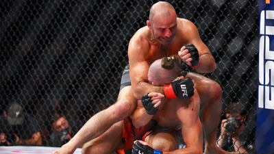 Glover Teixeira attempts to submit Jiri Prochazka during their light heavyweight championship fight at UFC 275. Getty