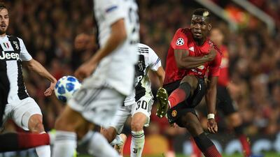 Manchester United's French midfielder Paul Pogba hits the post with this shot during the Champions League Group H match against Juventus at Old Trafford. AFP