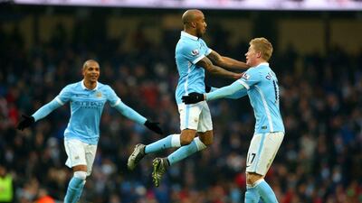 Fabian Delph celebrates with Kevin De Bruyne after scoring Manchester City’s first goal against Crystal Palace on Saturday. Alex Livesey / Getty Images