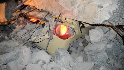 epa06100685 A car is covered with debris following an earthquake on the island of Kos, Greece, 21 July 2017. Two earthquake-related fatalities were reported on the island of Kos in the early morning hours of 21 July, while several others were injured from a strong 6.7 magnitude earthquake that shook the island and much of the southeast Aegean region and southwestern Turkey. A 39-year-old Turk and a 27-year-old Swede are reportedly dead, according to sources. Five persons who have been seriously injured were transferred to the Heraklion University Hospital in Crete. Some buildings have suffered serious damage. The island's port has sustained damage while the airport is operating normally. EPA/GIANNIS KIARIS