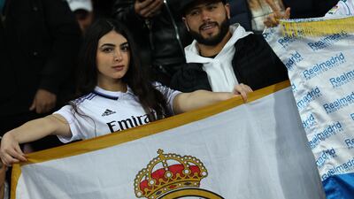Real Madrid supporters hold a flag before kick-off at the Prince Moulay Abdellah Stadium. AFP