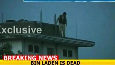 A Pakistani soldier is seen searching the building of a compound following the attack in Abbottabad that killed Osama bin Laden.