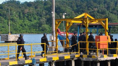 An Indonesian police firing squad boards a boat in Cilacap to cross to Nusakambangan maximum security prison island on April 28, 2015, ahead of the planned execution of drug convicts. Azka/AFP Photo