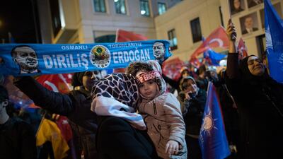 Supporters of Justice and Development Party (AK Party) hold a banner featuring the picture of Turkish President Recep Tayyip Erdogan as they wait for results in the Istanbul mayoral race in the local election in Istanbul. EPA