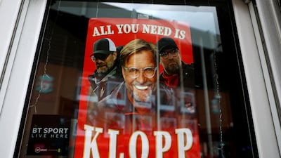 A poster in a window in Liverpool ahead of Jurgen Klopp's final match as club manager. Reuters