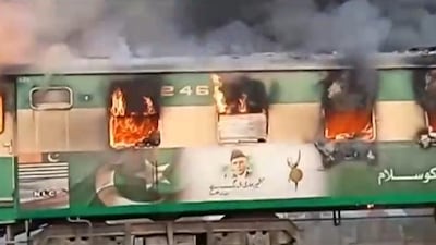 A fire burns a train carriage near the town of Rahim Yar Khan in the south of Punjab province, Pakistan October 31, 2019. Reuters