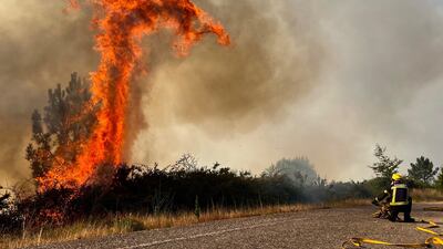 Picture dated 31 July 2022 and made available 08 August 2022 shows firefighters at work in the village of A Caniza, Pontevedra, Galicia region, Spain. According to the European Forest Fire Information System (EFFIS) this is the worst year of wildfires in Spain in 30 years. EPA / Sxenick