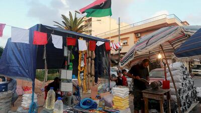 Men sell coal and knives ahead of Eid Al Adha in Benghazi, Libya. Esam Omran Al Fetori / Reuters
