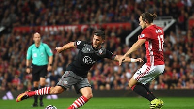 Shane Long of Southampton takes on Daley Blind of Manchester United last week. Michael Regan / Getty Images