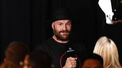 Tyson Fury speaks at the weigh-in. EPA