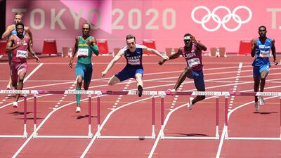 Karsten Warholm of Norway leads Rai Benjamin of the US down the home straight.