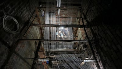 Weavers make traditional Egyptian rugs at a textile workshop in Atmida village in Dakahliya governorate, Egypt. Reuters