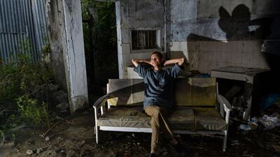 Ahadi Firsawan,a survivor of the December 26, 2004 tsunami, sitting in his house in Kajhu, Aceh province. AFP