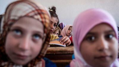 Syrian children attend class at the public school in Madaya village in the Idlib province, Syria. AP Photo