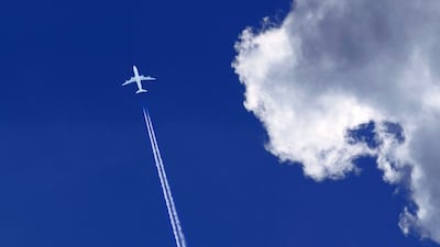 Persistent warming contrails trap heat, accounting for roughly one-third of aviation's total climate impact. Photo: Adobe