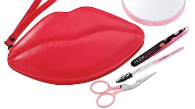The brow set features a slant tweezer, brow shaping scissors and brush, a 10x mirror and a lip-shaped cosmetic bag