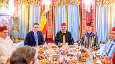 Moroccan King Mohammed VI, centre, and Spanish Prime Minister Pedro Sanchez, second left, share an iftar meal in Sale, Morocco. AP