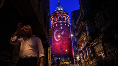 A man walks on a street near the Galata Tower, Istanbul. Ozan Kose / AFP Photo