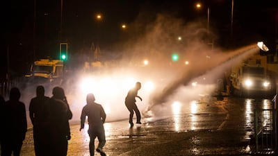 Nationalist youths clash with police on the Springfield Road. EPA