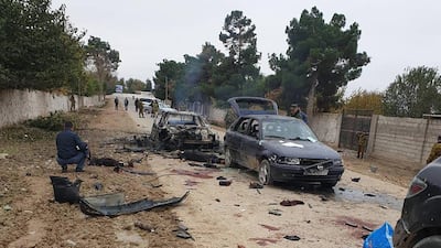A handout picture taken and released on November 6, 2019 by the Ministry of Internal Affairs of the Republic of Tajikistan shows police investigators working at the site of an attack at the Ishkobod border post. AFP