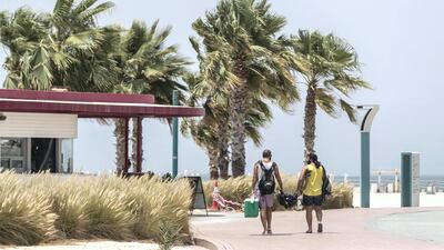 Residents soak in the sunshine at Kite Beach in Jumeirah, Dubai. Antonie Robertson / The National