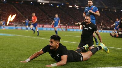 Rieko Ioane, left, celebrates one of his two second half tries during New Zealand's emphatic victory over France at Eden Park. Anthony Au-Yeung / Getty Images
