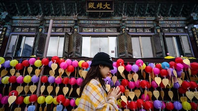 A South Korean Buddhist prays at the Bongeunsa Temple as students sit the annual university entrance exam, known as Suneung, in Seoul. AFP