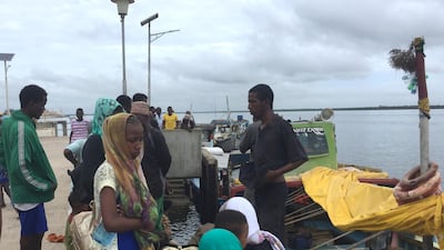 Travellers gather at the Lamu jetty following an attack by Al Shabab militants on the military base in Manda. Reuters