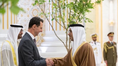 Sheikh Mansour bin Zayed, Deputy Prime Minister and Minister of the Presidential Court, greets Mr Al Assad at Qasr Al Watan. Presidential Court