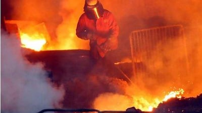 A foundryman works with molten metal inside the Corus Steelworks at Redcar last year. Christopher Furlong / Getty Images