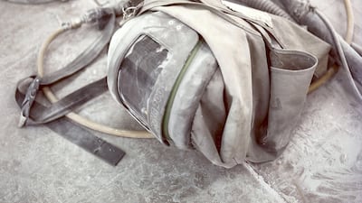 A blasters helmet lies on the floor while the operator takes a break.