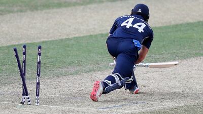 Richie Berrington of Scotland is bowled by the UAE's Rohan Mustafa. Chris Whiteoak / The National