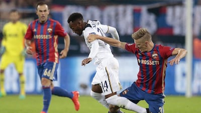 Tottenham’s Georges-Kevin N’Koudou, centre, struggles for the ball with CSKA’s Pontus Wernbloom. Ivan Sekretarev / AP Photo