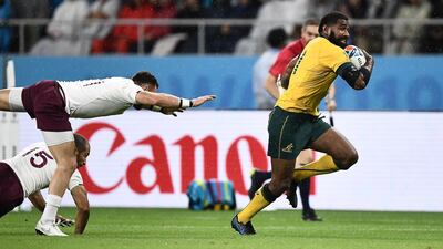 Marika Koroibete of Australia breaks through to go on and score his team's second try. AFP