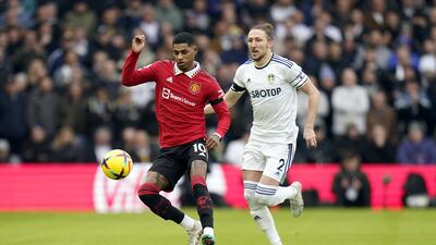 Manchester United's Marcus Rashford and Leeds United's Luke Ayling compete for the ball. PA