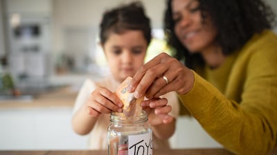 In child's early years, parents have a golden opportunity to start their financial literacy journey. Getty