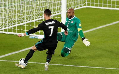 Al Jazira goalkeeper Ali Khaseif saves from Real Madrid’s Cristiano Ronaldo in the first half. Amr Abdallah Dalsh / Reuters