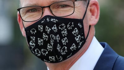 Irish Foreign Minister Simon Coveney wearing a face mask, is seen in Brussels, Belgium. REUTERS/Yves Herman/File Photo