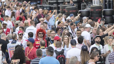 Fans walk through pit lane during previews for the Abu Dhabi Formula One Grand Prix at Yas Marina Circuit in Abu Dhabi on November 23, 2017. Christopher Pike / The National