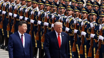 US President Donald Trump reviews an honour guard with Chinese President Xi Jinping during a welcome ceremony at the Great Hall of the People in Beijing. Getty Images