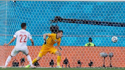 Spain's midfielder Pablo Sarabia scores his team's third goal. AFP