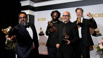 Joseph Patel, from left, Questlove, David Dinerstein and Robert Fyvolent, winners of the award for best music film for 'Summer of Soul,' pose in the press room. AP