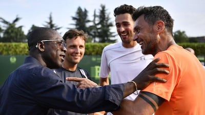 Paolo Maldini, right, speaks with former AC Milan teammate Clarence Seedorf following his men's doubles defeat in the ATP Aspria event. Marco Bertorello / AFP