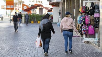 Shoppers on Al Hudaiba Road, Satwa after shops reopened to customers on Saturday, April 25th.