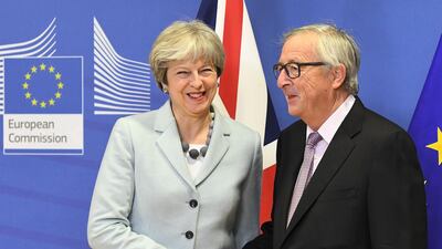 Progress in Brexit negotiations between UK prime minister Theresa May and European Commission president Jean-Claude Juncker bodes well for the world economy in 2018. Emmanuel Dunand / AFP