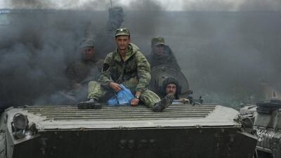 Russian-backed separatists guard the crash site of the MH17 plane near the village of Hrabove, eastern Ukraine, on July 16, 2015. Mstyslav Chernov/AP Photo