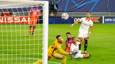 Chelsea striker Olivier Giroud scores the first of his four goals against Sevilla in the Champions League in Spain on Wednesday, December 2. Chelsea won the match 4-0. Reuters