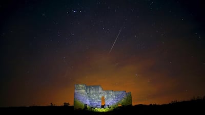 Meteors streak across the sky over a Roman theatre in the ruins of Acinipio near Ronda, southern Spain. Jon Nazca / Reuters